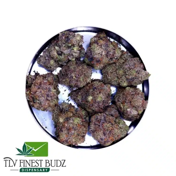 A black tray holds neatly arranged, dense astro pink strain buds, showcasing varying shades of green and purple. TLV Finest Budz logo visible.