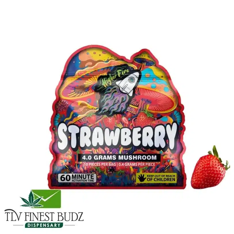 Colorful packaging for 4 grams of strawberry-flavored mushrooms, featuring vibrant art and a real strawberry beside it.